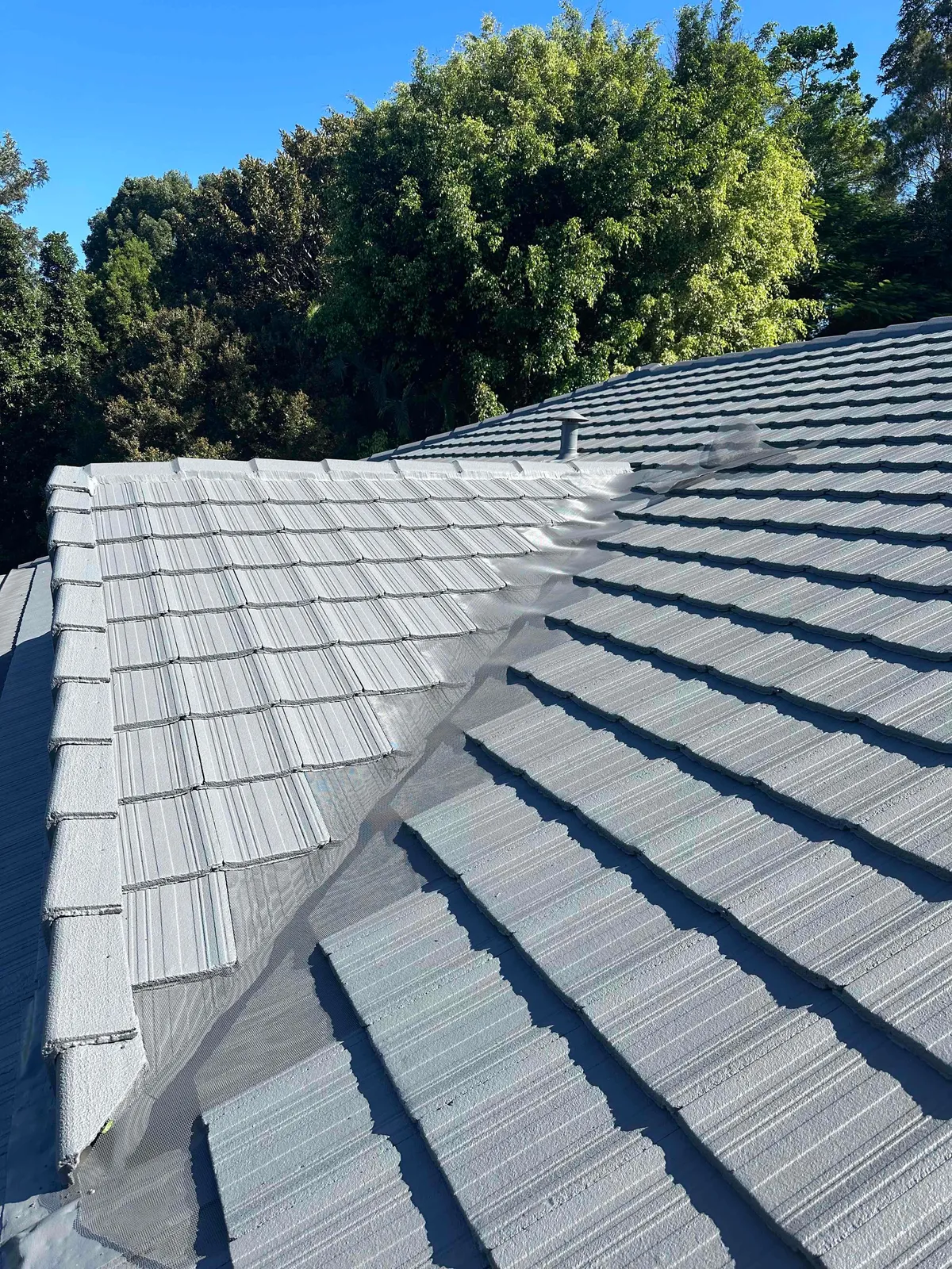 Aluminium mesh fitted along a tiled roof valley