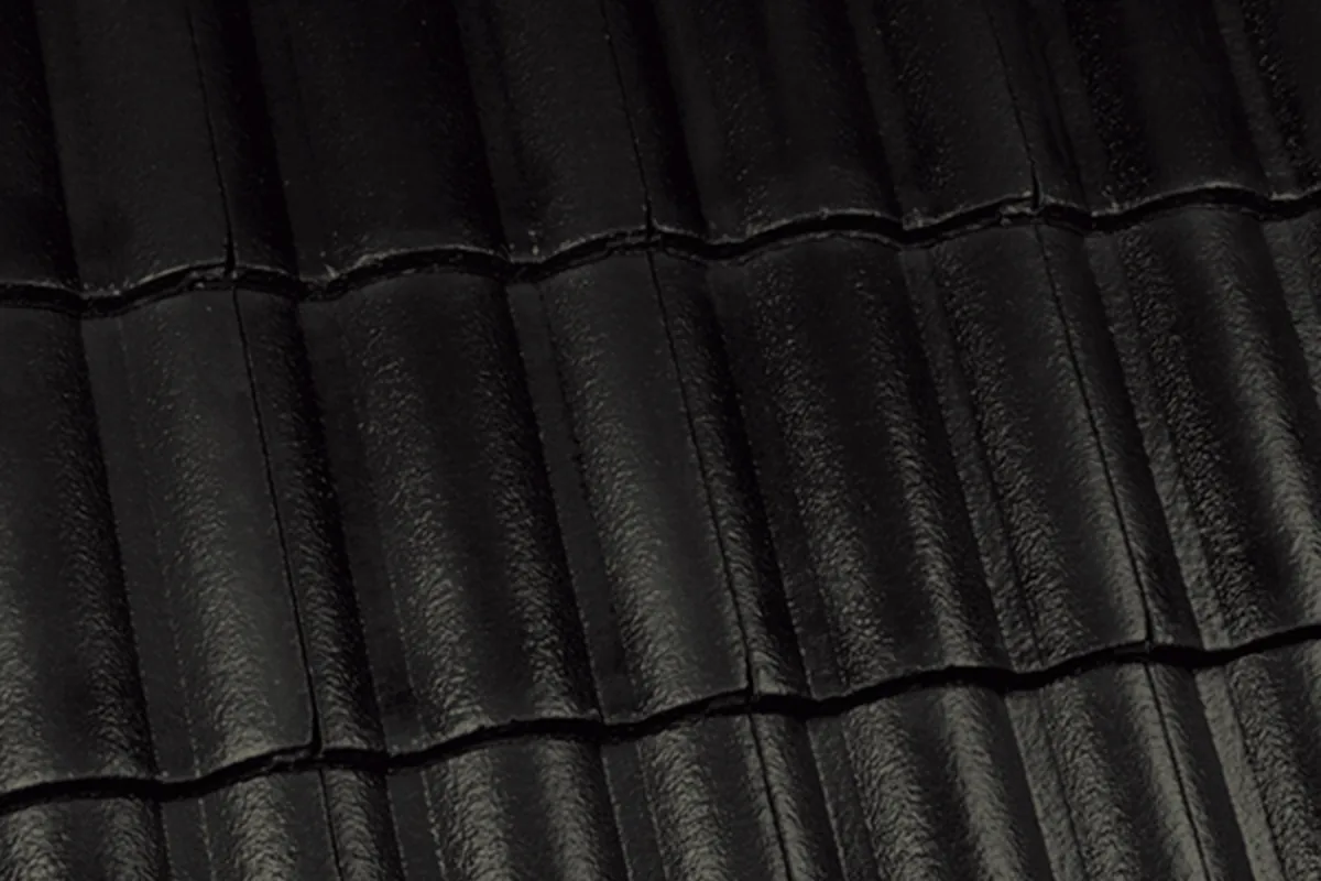 Monier-style concrete roof tiles in dark charcoal profile